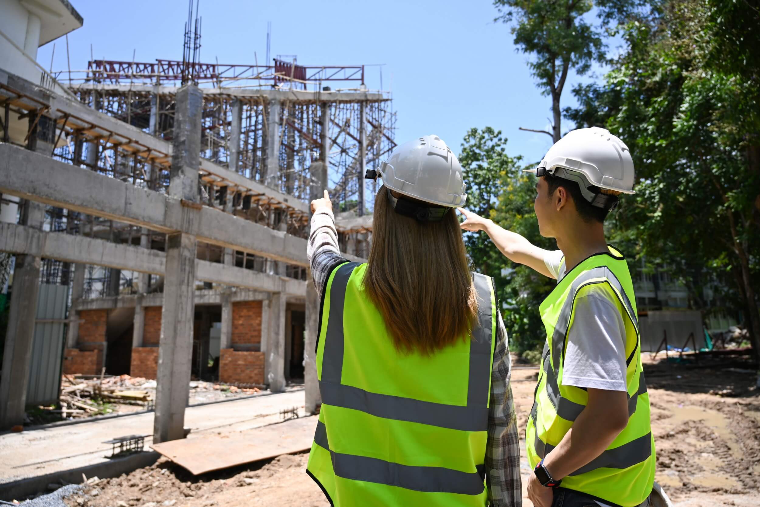 back view civil engineer discussing planning deve