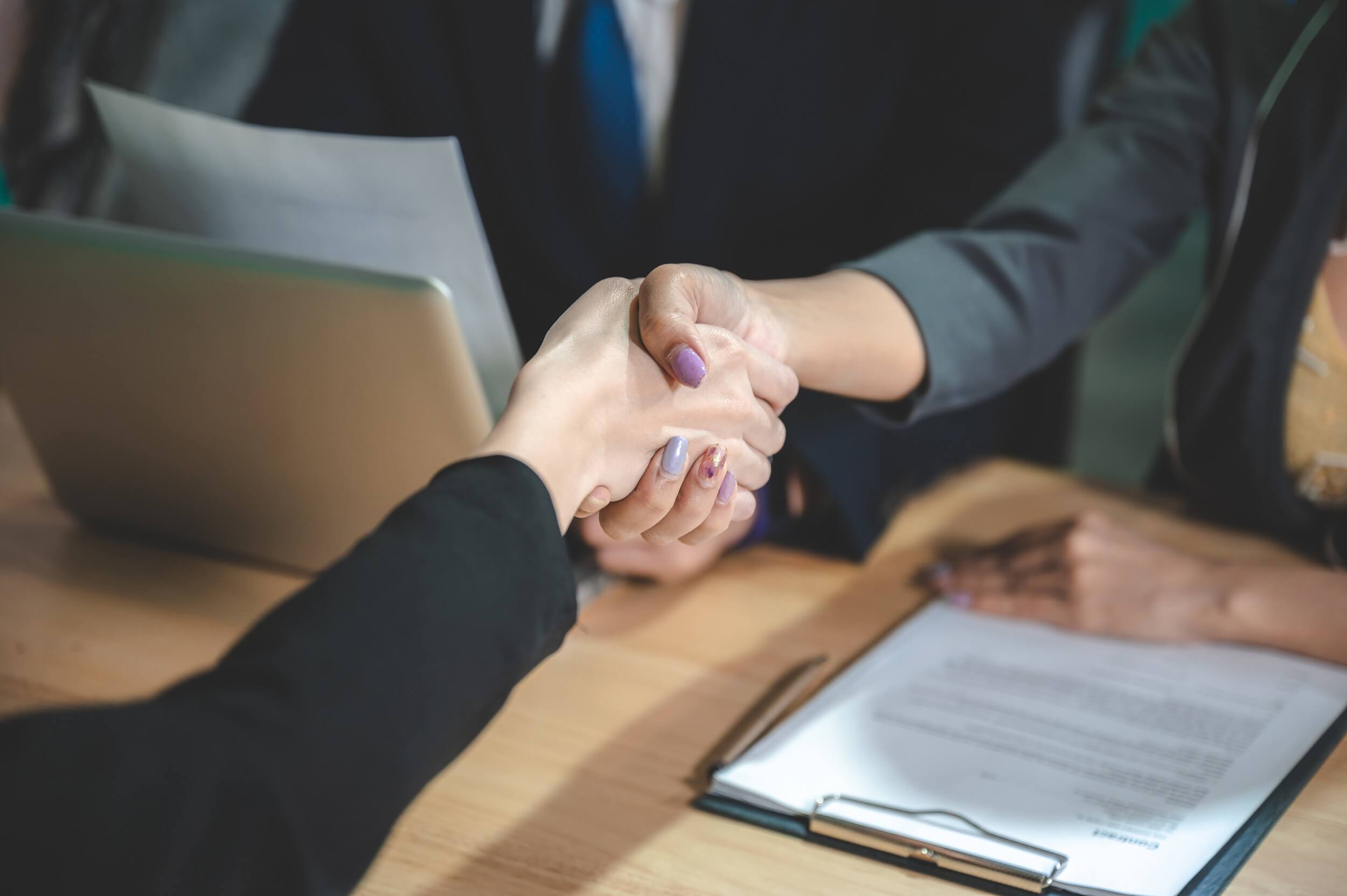 business people are shaking hand for job interview